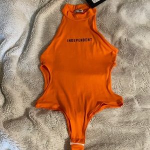 New never been worn with tags. Cut out bodysuit.